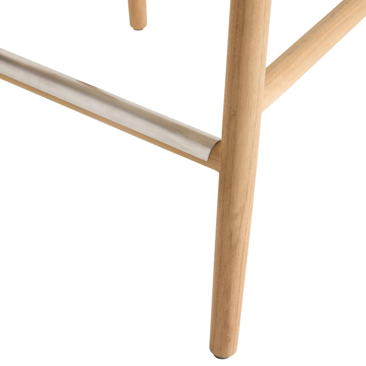Close-up of a wooden chair leg on a white background