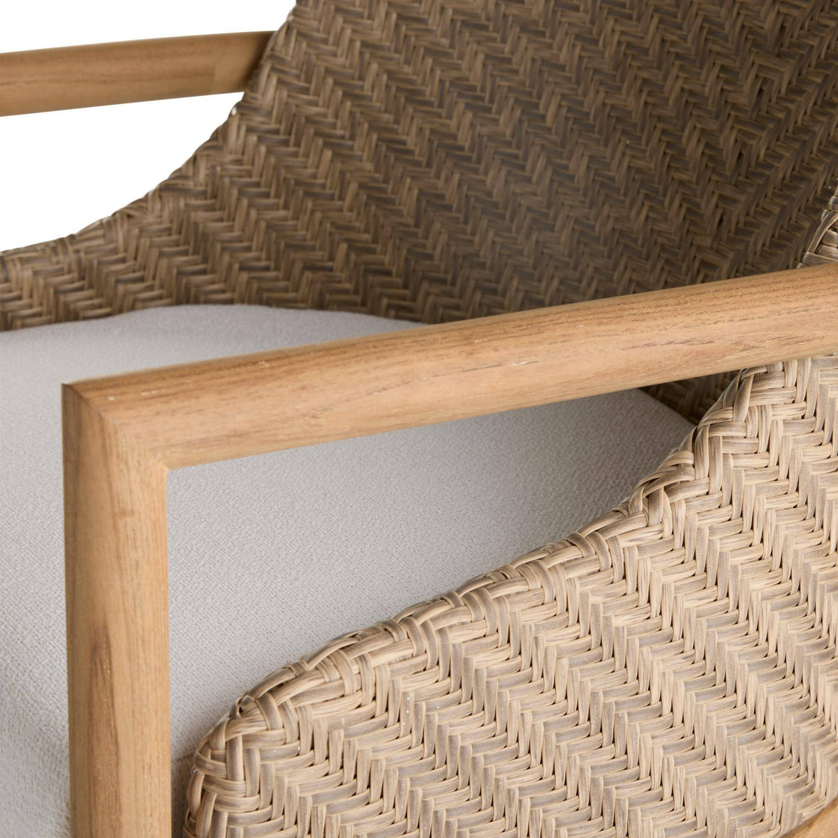 Close-up of a wicker chair with wooden frame on a white background