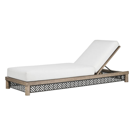 White cushioned lounge chair with a decorative wooden frame on a white background