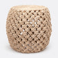Beige woven side table on a white background