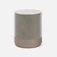 A modern cylindrical side table or stool with a matte metallic finish, featuring a silver-gray upper body and a warm bronze base, shown on a clean white background.