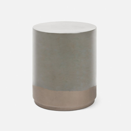 A modern cylindrical side table or stool with a matte metallic finish, featuring a silver-gray upper body and a warm bronze base, shown on a clean white background.