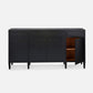 A modern black sideboard cabinet with three drawers, two doors, and one open door showing a wooden interior, photographed against a light gray background.