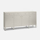 A modern sideboard cabinet with a textured light beige linen finish, featuring three drawers on top, two doors in the center, and four tapered legs, accented with small round gold knobs.