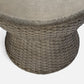 Concrete table with woven base on a white background