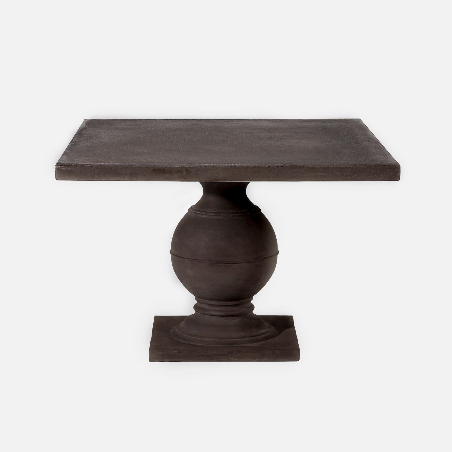 A dark brown wooden pedestal table with a square top, a rounded central base, and a rectangular footplate, shown against a plain light gray background.