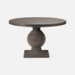 Round pedestal table with a textured surface on a white background
