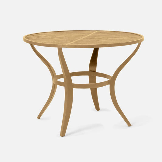 Round gold metal table with a white background