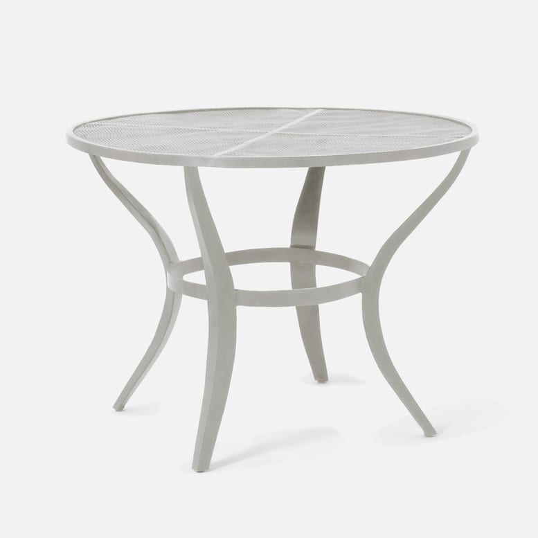 Round metal outdoor table on a white background