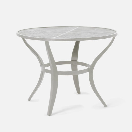 Round metal outdoor table on a white background