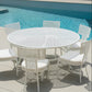 White outdoor dining table and chairs by a pool