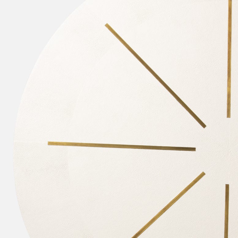 Close-up of a clock with gold hands on a white background