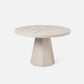 Round beige table with a geometric base on a white background