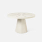 Round white table with a star-like pattern on a white background