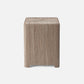 Square wooden stool with a textured surface on a white background