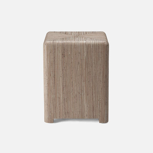 Square wooden stool with a textured surface on a white background