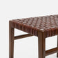 Wooden bench with woven seat on a white background