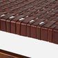 Close-up of a woven brown leather surface