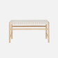 Wooden bench with woven seat on a white background
