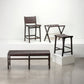 Set of woven outdoor furniture including a bench, stools, and a small table on a white background.