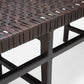 Close-up of a woven bench with metal frame on a white background