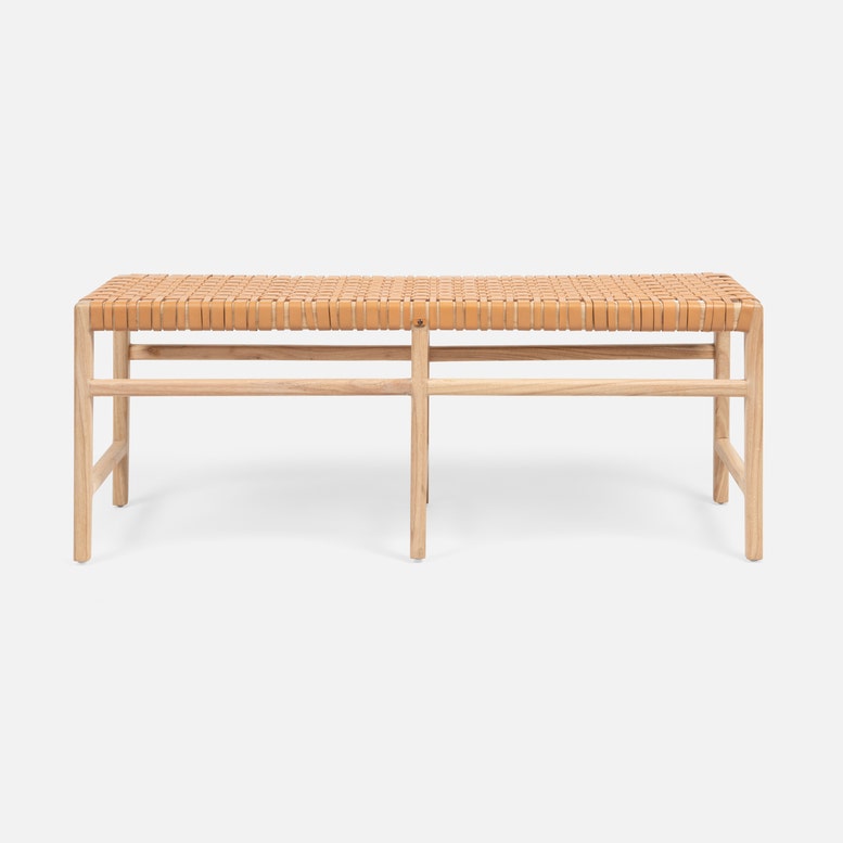Wooden bench with woven seat on a white background