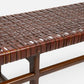 Woven brown leather bench on a white background