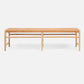 Wooden bench with woven seat on a white background