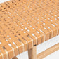 Close-up of a woven chair seat with a neutral background