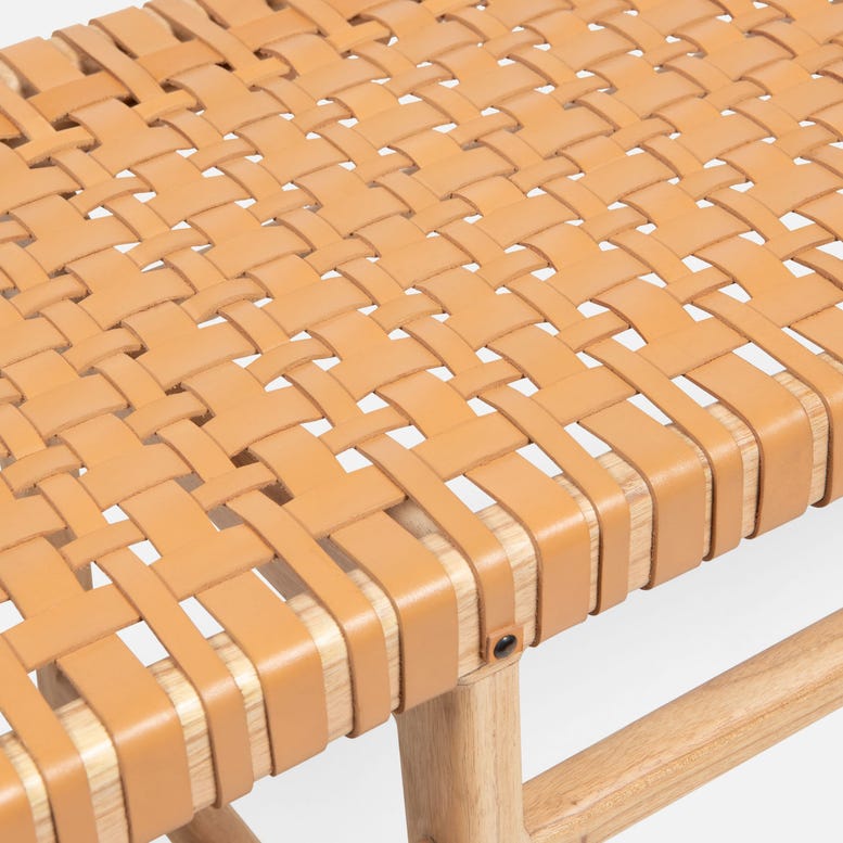 Close-up of a woven chair seat with a neutral background