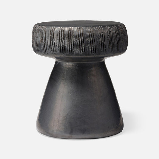Black textured stool on a white background