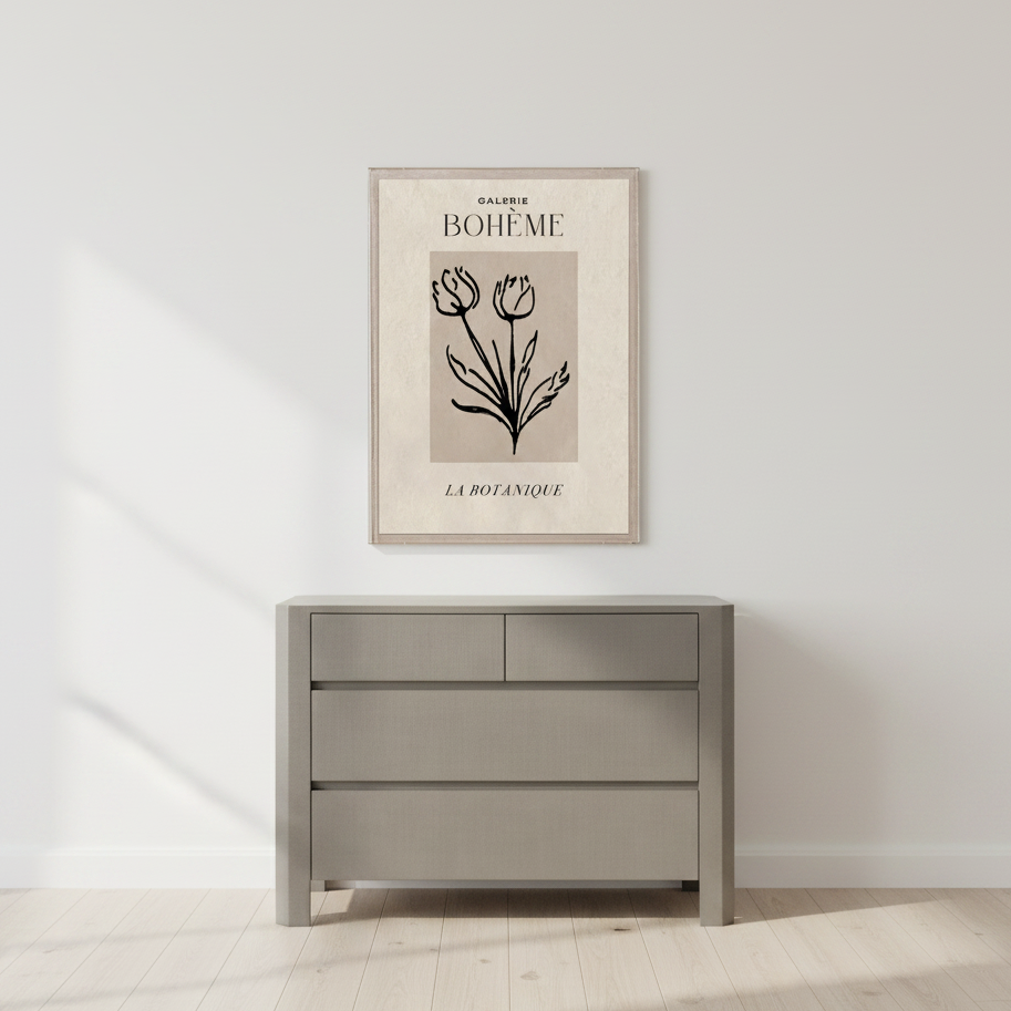 Gray dresser with a framed botanical print on a white wall.
