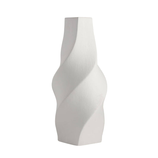 White, wavy-patterned vase on a white background