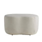 Round beige ottoman on a white background
