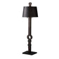 Black floor lamp with decorative base on a white background