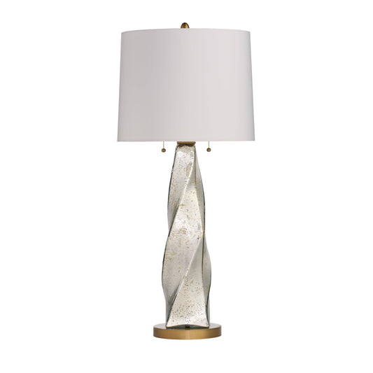 Table lamp with a decorative base and white shade on a white background