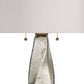 Close-up of a lamp with a textured glass shade and metallic pull chain on a white background