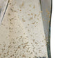 Close-up of a textured ceramic vase with speckled pattern