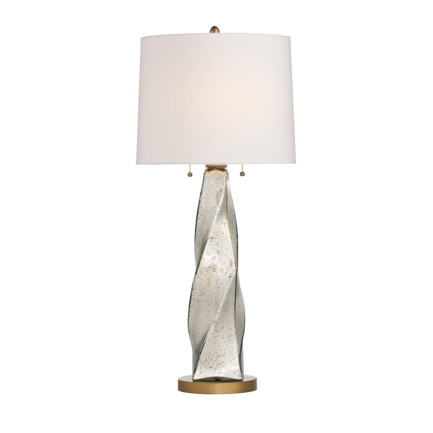 Table lamp with a decorative glass base and white shade on a white background