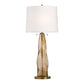Table lamp with a brown glass base and white shade on a white background