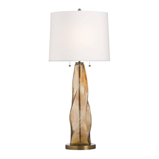 Table lamp with a brown glass base and white shade on a white background