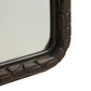 Rectangular mirror with a textured bronze frame on a white background