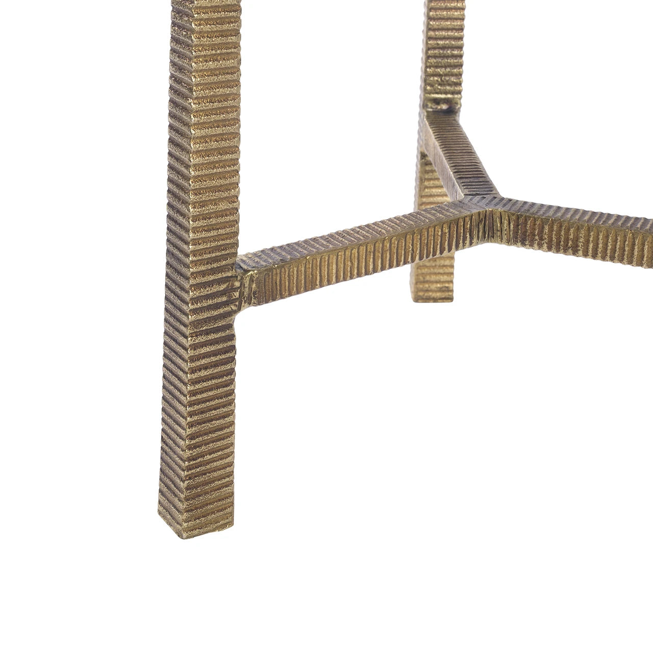 A modern accent table with a round white top and a textured, woven metallic gold base, shown against a plain white background.