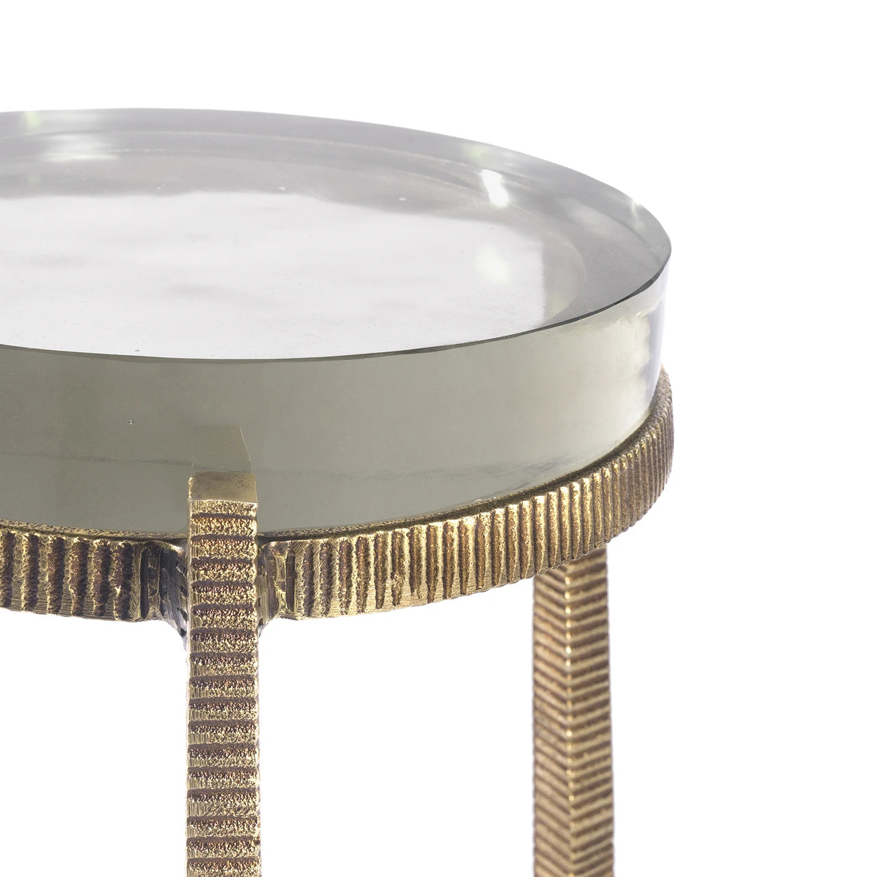 A modern accent table with a round white top and a textured, woven metallic gold base, shown against a plain white background.