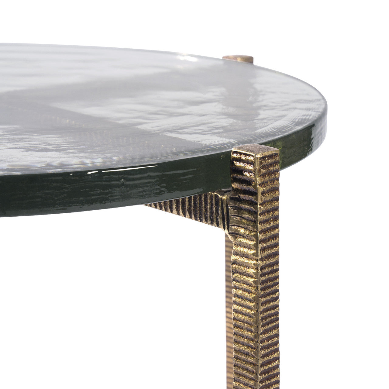 Round glass table with a textured bronze base on a white background