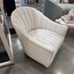 White upholstered chair in a showroom setting