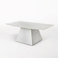 White marble table with a geometric base on a white background
