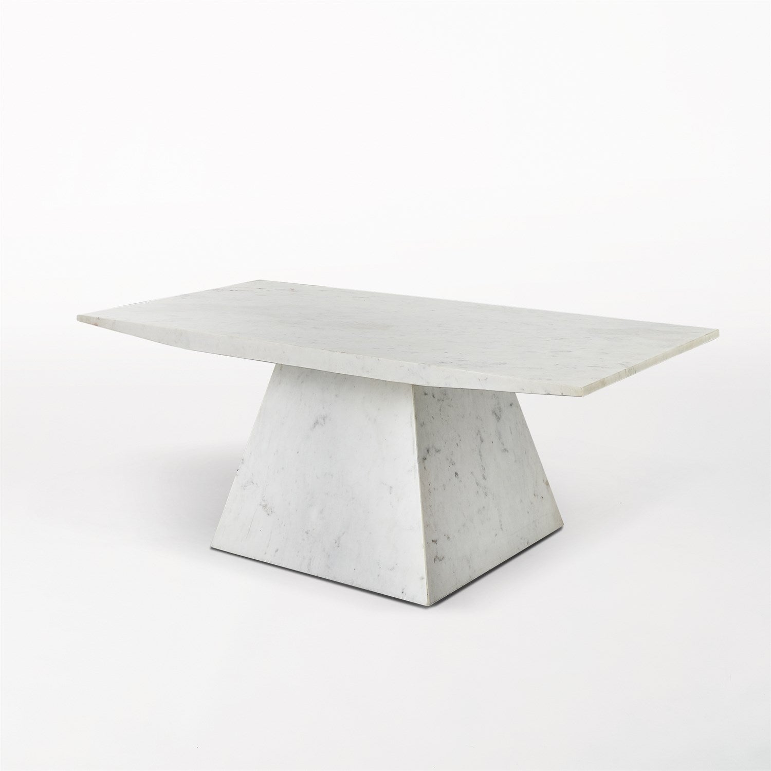 White marble table with a geometric base on a white background