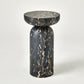 Marble side table with a black and gold pattern on a white background