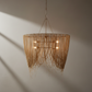 Woven pendant light fixture on a neutral background